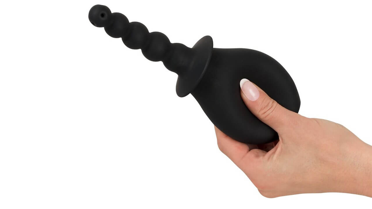 Schwarze Analdusche aus Silikon mit ergonomischem Design und mehreren Kugelformen für eine angenehme Anwendung.